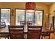 Bright dining room with large table and view of pool and patio at 702 Treasure Boat Way, Sarasota, FL 34242