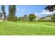 Landscaped backyard with lush green grass at 7106 Bright Creek Dr # 44, Sarasota, FL 34231