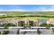 Aerial view of condo building with parking and scenic views at 7015 River Hammock Dr # 201, Bradenton, FL 34212