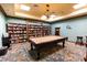 Game room with pool table and bookshelves at 7015 River Hammock Dr # 201, Bradenton, FL 34212