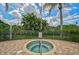 Community hot tub with surrounding brick patio at 7157 Del Lago Dr, Sarasota, FL 34238