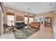 Open living area showcasing comfortable seating, a large TV and views to kitchen at 7157 Del Lago Dr, Sarasota, FL 34238