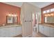 Double vanity bathroom with granite countertops and a separate toilet area at 7157 Del Lago Dr, Sarasota, FL 34238