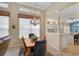 Formal dining room with chandelier and view to kitchen at 7157 Del Lago Dr, Sarasota, FL 34238