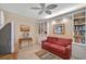 Home office features built-in shelving and a comfortable sofa at 7157 Del Lago Dr, Sarasota, FL 34238