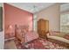 Bedroom with accent wall and built-in armoire at 7157 Del Lago Dr, Sarasota, FL 34238