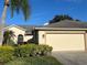 Front view of single-Gathering house with two-car garage at 5717 Cottonwood St, Bradenton, FL 34203