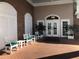 Inviting community entrance with brick facade, white columns, and comfortable seating at 5717 Cottonwood St, Bradenton, FL 34203