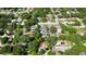 Wide aerial view of a residential neighborhood with various homes and lush greenery at 1820 7Th E Ave, Bradenton, FL 34208