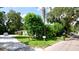 Ranch home with a spacious front yard and mature trees at 1820 7Th E Ave, Bradenton, FL 34208
