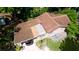 Aerial view showing house needing roof repair, with a car parked in the driveway at 1820 7Th E Ave, Bradenton, FL 34208