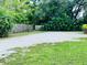 Large backyard with grassy area and wooden fence at 1820 7Th E Ave, Bradenton, FL 34208