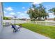 Large backyard with patio, grill, and basketball goal at 4218 Day Bridge Pl, Ellenton, FL 34222