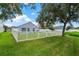 Backyard with a white fence and access gate at 4218 Day Bridge Pl, Ellenton, FL 34222