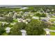 Wide aerial view showing a house with solar panels near the water at 1420 Everest Rd, Venice, FL 34293