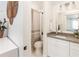 Clean bathroom with a shower/tub combo and white cabinets at 1420 Everest Rd, Venice, FL 34293