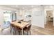 Bright dining room with hardwood floors and a view of the kitchen at 1420 Everest Rd, Venice, FL 34293