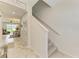 Open staircase with carpeted steps and a view into the dining area at 10924 Brightleaf Ct, Riverview, FL 33569