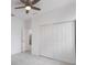 Simple bedroom with ceiling fan and sliding door closet at 1001 2Nd W St, Bradenton, FL 34205