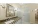 Bathroom with granite vanity, frosted glass shower door, and modern fixtures at 3309 Highlands Bridge Rd # 58, Sarasota, FL 34235