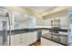 Modern kitchen with granite countertops and stainless steel appliances at 3309 Highlands Bridge Rd # 58, Sarasota, FL 34235