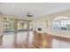 Spacious living room with wood floors, fireplace, and sliding doors leading to the patio at 3309 Highlands Bridge Rd # 58, Sarasota, FL 34235