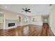 Living room with fireplace, wood floors, and abundant natural light at 3309 Highlands Bridge Rd # 58, Sarasota, FL 34235