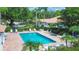 Community pool with lounge chairs and patio area at 3309 Highlands Bridge Rd # 58, Sarasota, FL 34235