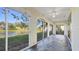 Enclosed sunroom or patio with large sliding windows and serene water views at 3309 Highlands Bridge Rd # 58, Sarasota, FL 34235