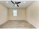 Spacious bedroom with ceiling fan and large window at 4519 Bent Tree Blvd, Sarasota, FL 34241