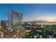 Aerial view of a modern highrise building at sunset at 668 Quay Commons # 1604, Sarasota, FL 34236