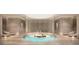 Tranquil spa with a central pool and comfortable lounge chairs at 668 Quay Commons # 1604, Sarasota, FL 34236