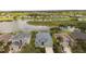 Houses on waterfront with lake and lush greenery at 5056 Lakehurst Ct, Palmetto, FL 34221