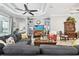 Bright living room with built-in shelving and a cozy seating area at 5056 Lakehurst Ct, Palmetto, FL 34221