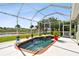 Inviting screened-in pool with brick coping and lake view at 5056 Lakehurst Ct, Palmetto, FL 34221