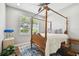 Charming bedroom with wooden four-poster bed at 5056 Lakehurst Ct, Palmetto, FL 34221