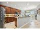 Spacious kitchen with wood cabinets and granite counters at 5056 Lakehurst Ct, Palmetto, FL 34221