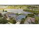 Houses on waterfront with lake and lush greenery at 5056 Lakehurst Ct, Palmetto, FL 34221
