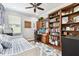 Bright bedroom with built-in shelving and desk at 5056 Lakehurst Ct, Palmetto, FL 34221