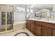 Elegant bathroom with double vanity, soaking tub, and shower at 5056 Lakehurst Ct, Palmetto, FL 34221