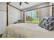 Charming bedroom with wooden four-poster bed and window view at 5056 Lakehurst Ct, Palmetto, FL 34221