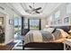 Main bedroom with king-size bed and sliding doors to lanai at 5056 Lakehurst Ct, Palmetto, FL 34221