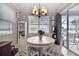Charming dining room with white round table and access to backyard at 5056 Lakehurst Ct, Palmetto, FL 34221