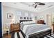 Main bedroom with king-size bed and access to private bathroom at 5056 Lakehurst Ct, Palmetto, FL 34221