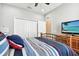 Spacious bedroom with a metal framed bed at 5056 Lakehurst Ct, Palmetto, FL 34221
