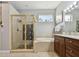 Bathroom with a garden tub, walk-in shower and wood cabinets at 5056 Lakehurst Ct, Palmetto, FL 34221