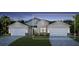 Two-car garage home with light colored siding at 18868 Dayspring Pl, Venice, FL 34293