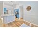 Modern kitchen with light blue cabinets, white countertops, and stainless steel appliances at 772 Nantucket Rd, Venice, FL 34293