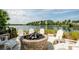 Relaxing fire pit area with lake view at 391 Aruba Cir # 302, Bradenton, FL 34209