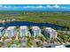 Luxury waterfront condos with a resort-style pool and lush landscaping at 391 Aruba Cir # 302, Bradenton, FL 34209
